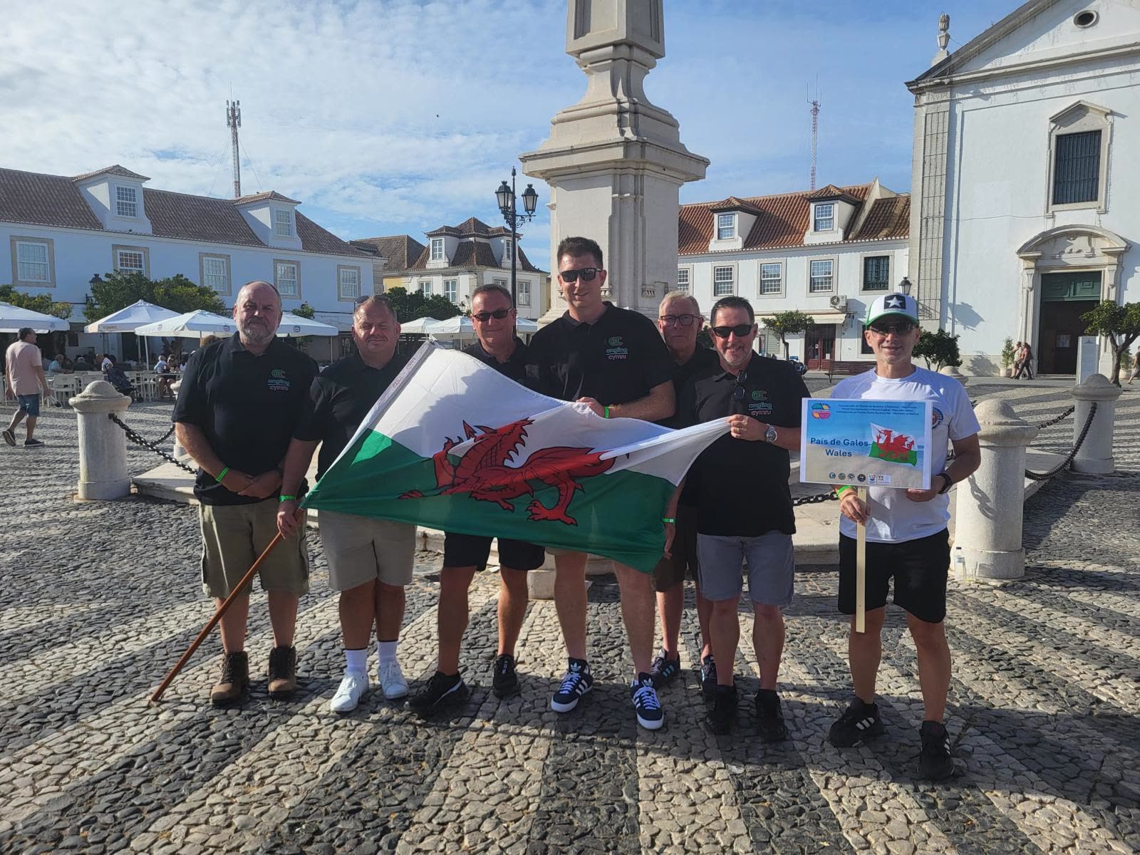 The Welsh squad gathered with the Welsh flag before an international competition